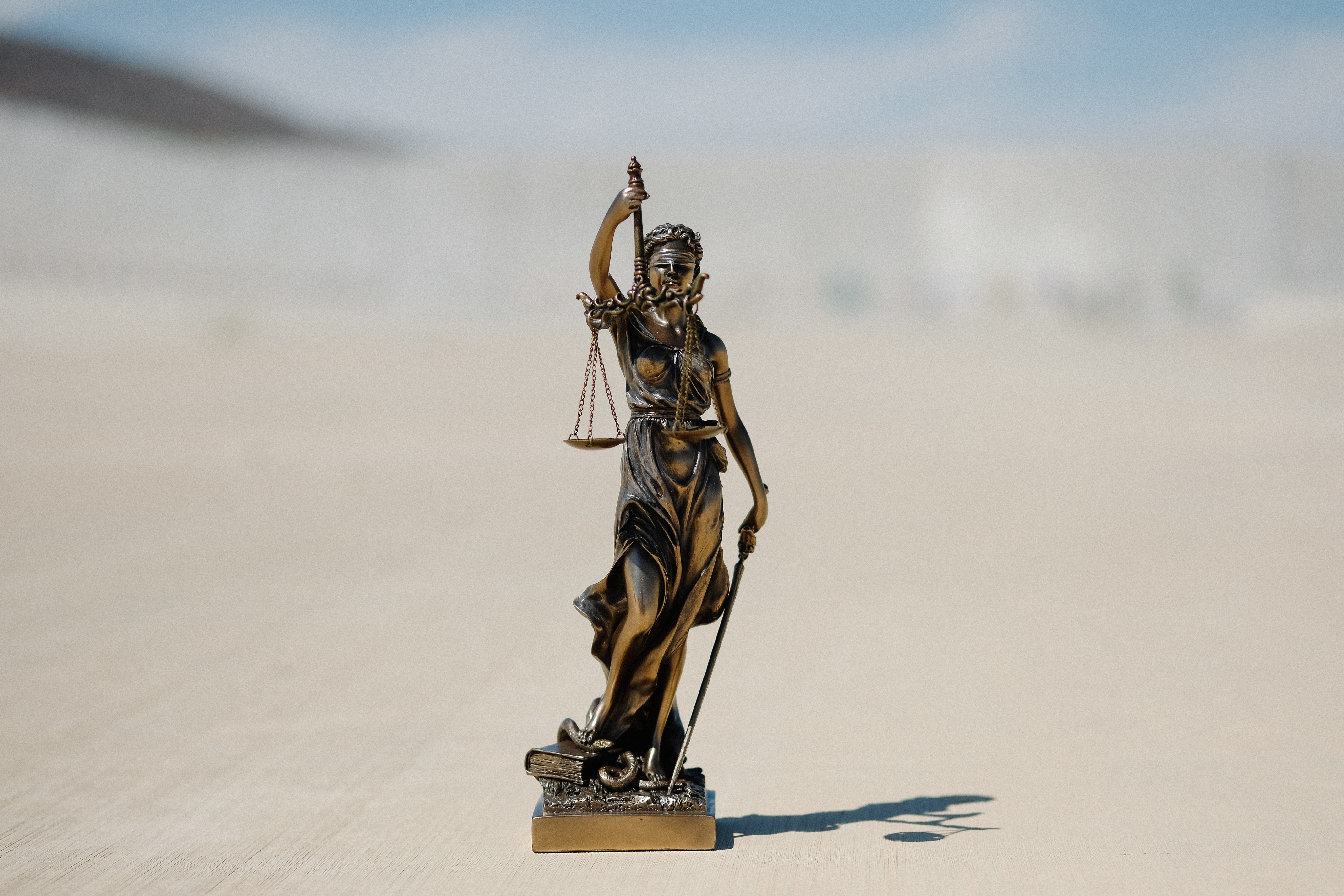 stock photo of a statue of Lady Justice,blindfolded and holding scales.